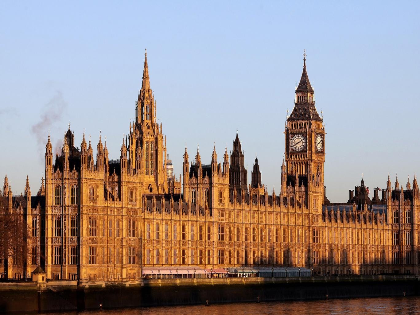The Houses of Parliament glow in the early morning sun