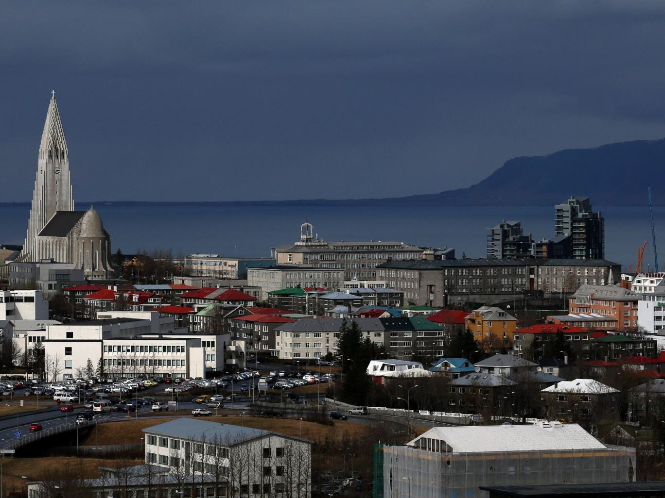 Buildings surround the Hallgrimskirkja tower in the Icelandic capital on April 7, 2014 in Reykjavik, Iceland.