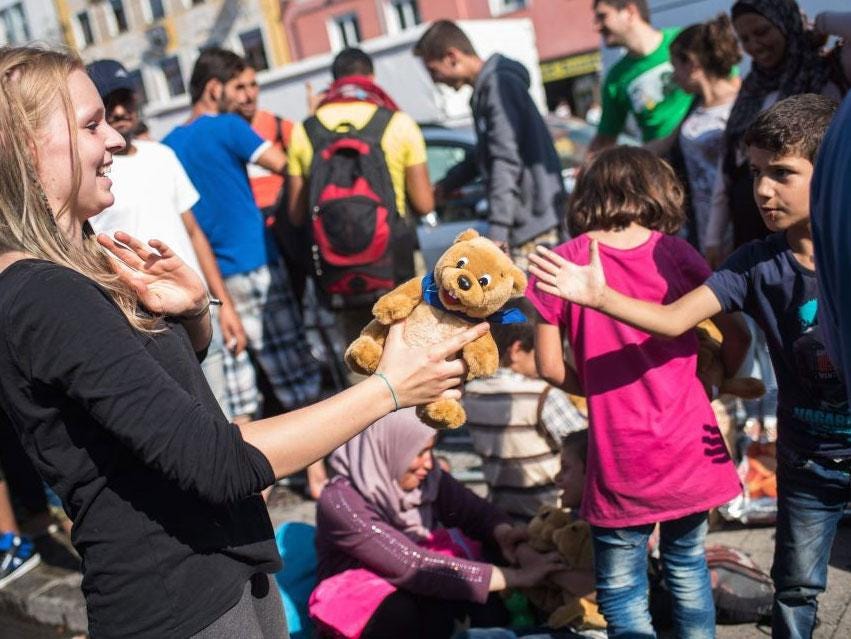 An employee of the initiative 'Refugee help Munich' hands out plushies to refugee children, at Munich's central train station, in Munich, Germany, 01 September 2015. H