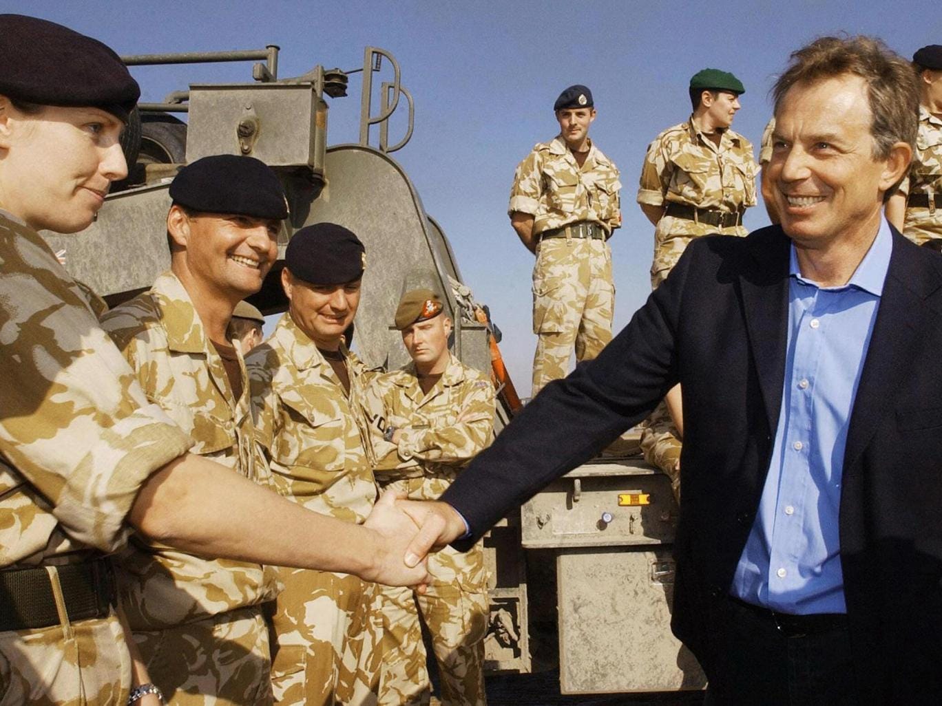 Tony Blair meets troops as he arrives in Basra for a visit to British soldiers in Iraq (AFP)