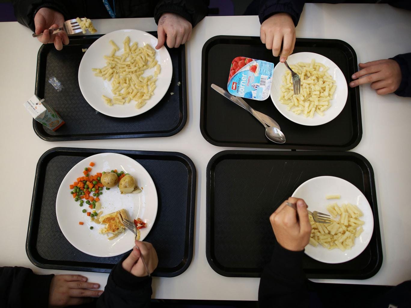 Students eat their school dinner