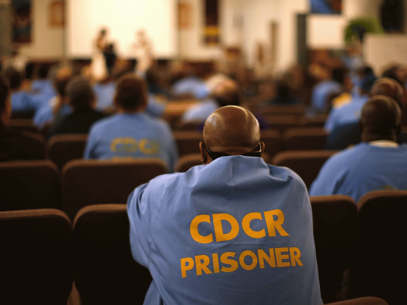 An inmate at San Quentin prison watches a production of Shakespeare's Julius Caesar