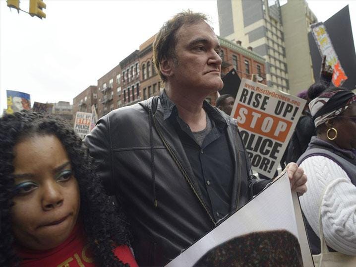 Quentin Tarantino participates in a rally to protest against police brutality 