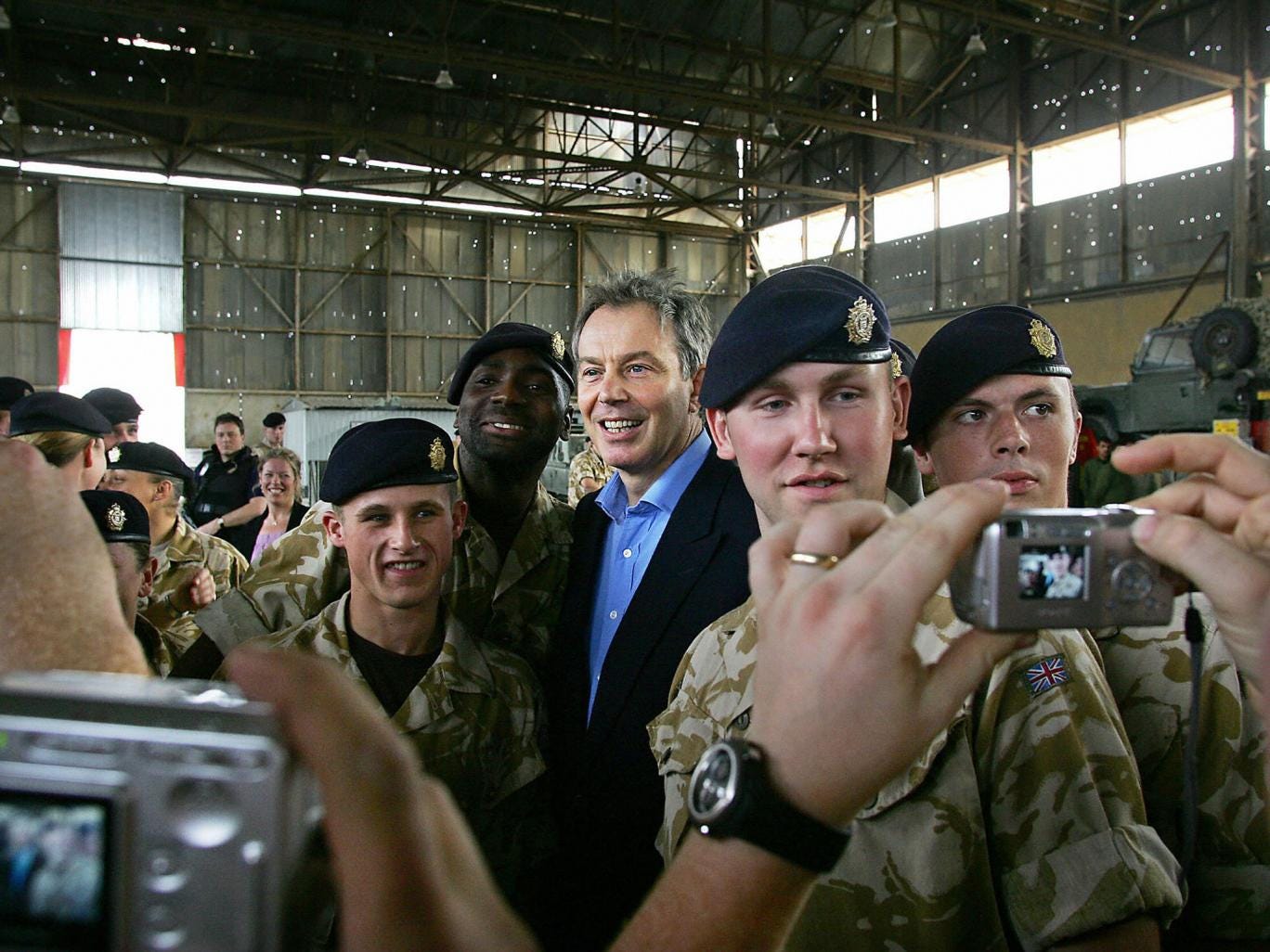 Tony Blair with British troops in Iraq in 2005. He implicitly denied on CNN he was a war criminal, saying he thought the impact of inaction in Syria was worse