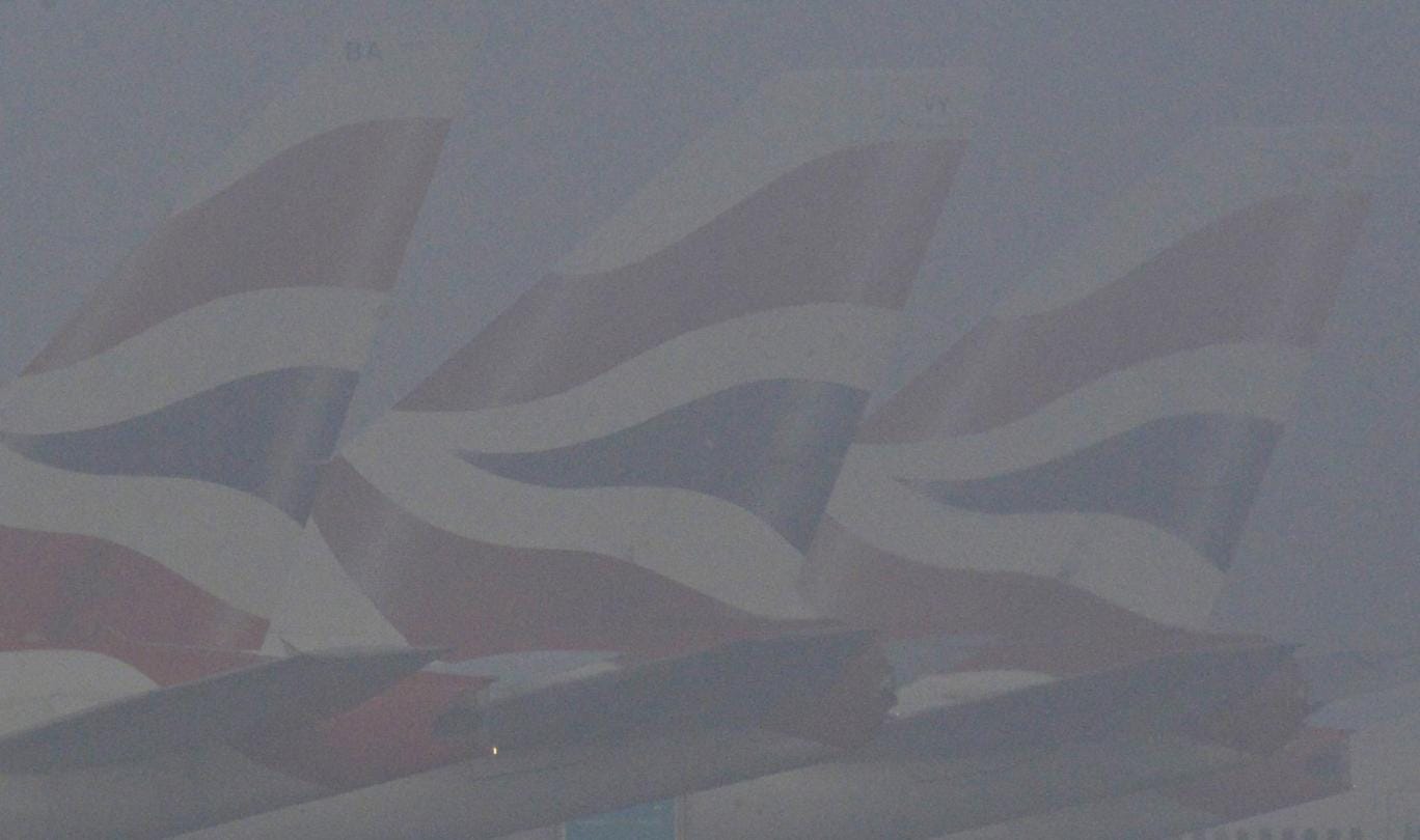 BA planes seen through thick fog at Heathrow