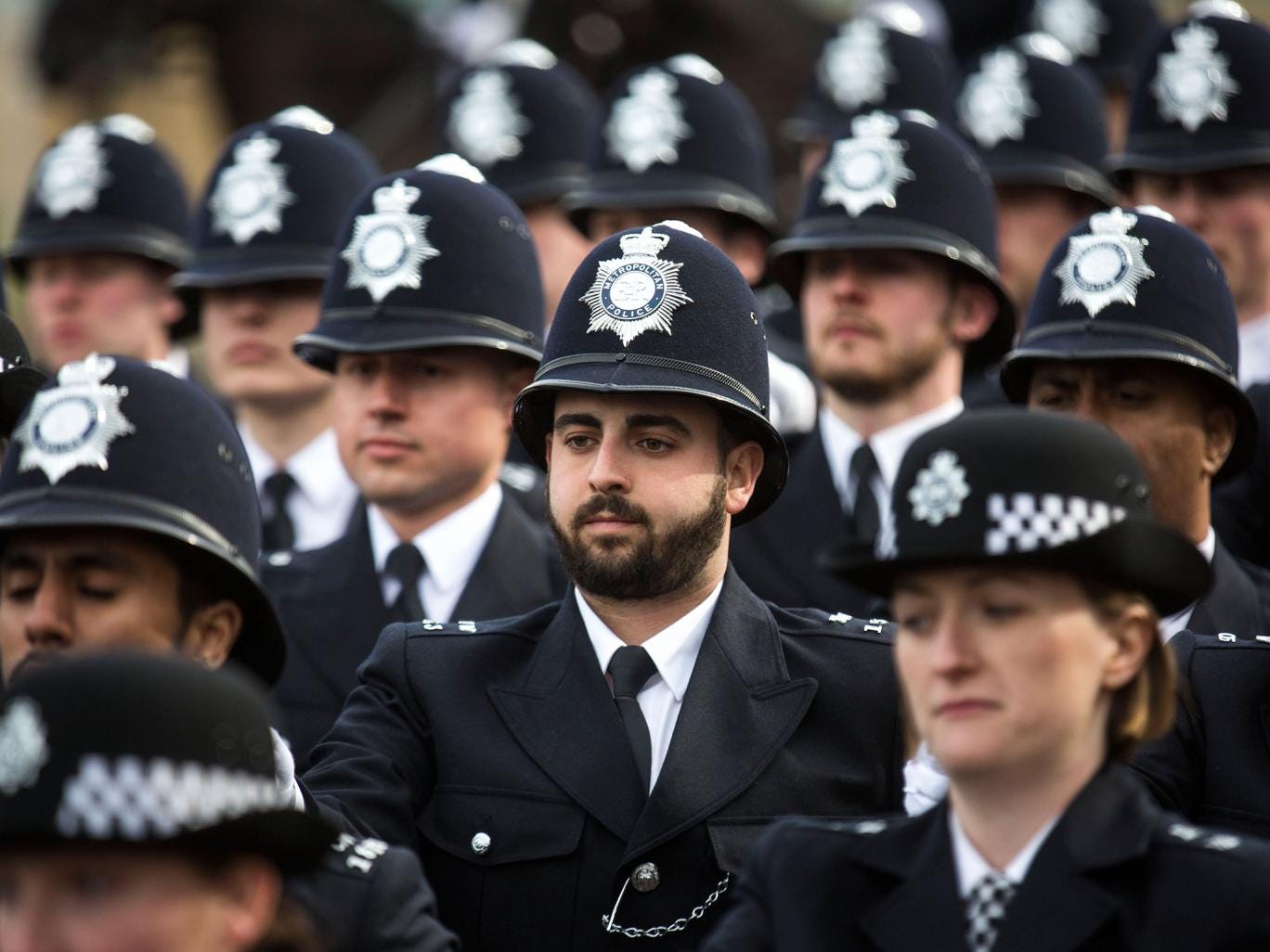 New recruits to the Metropolitan Police Service take part in their 'passing out parade' 