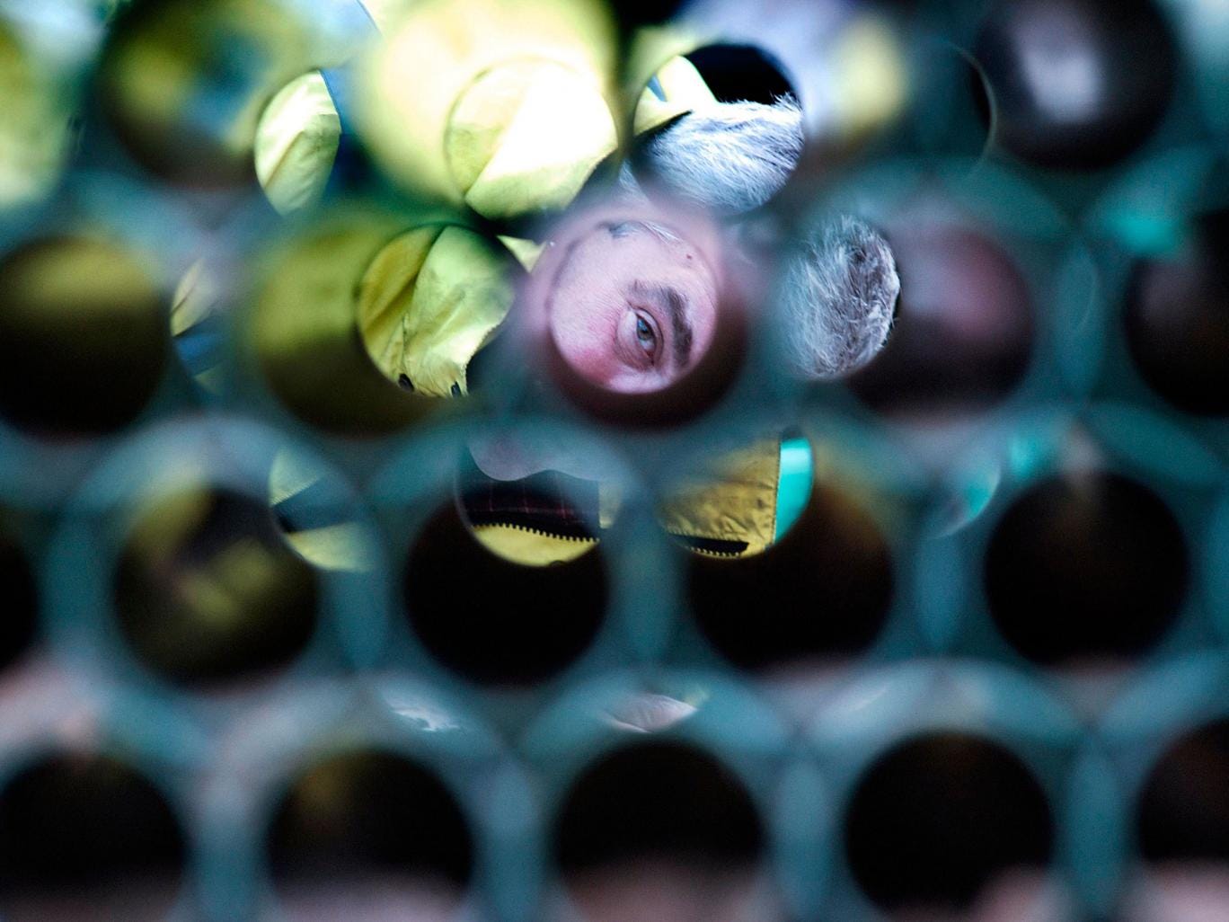 A telecoms supervisor checking piping in London