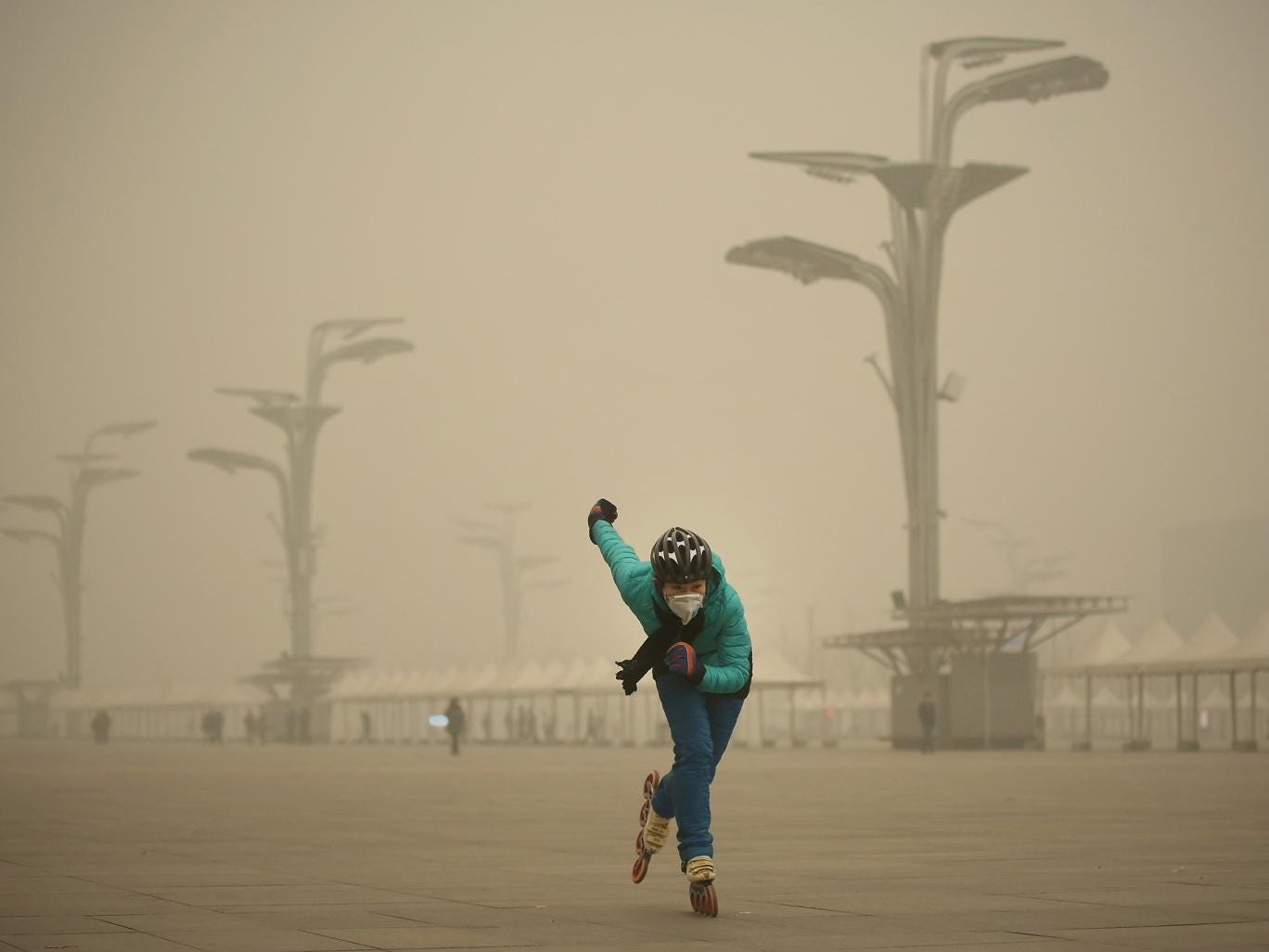 A rollerblader dons a mask to practise at Beijing’s Olympic Park