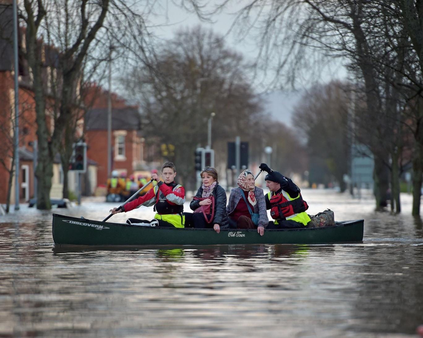 A rescue team helps to evacuate people from their homes after Storm Desmond floods Carlisle