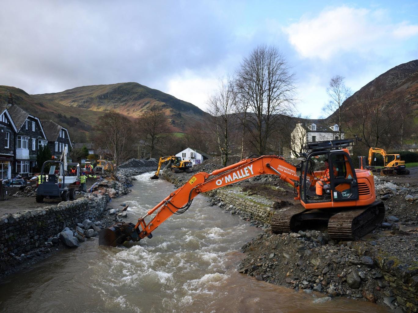 A digger is used to improve drainage in Glenridding in the Lake District