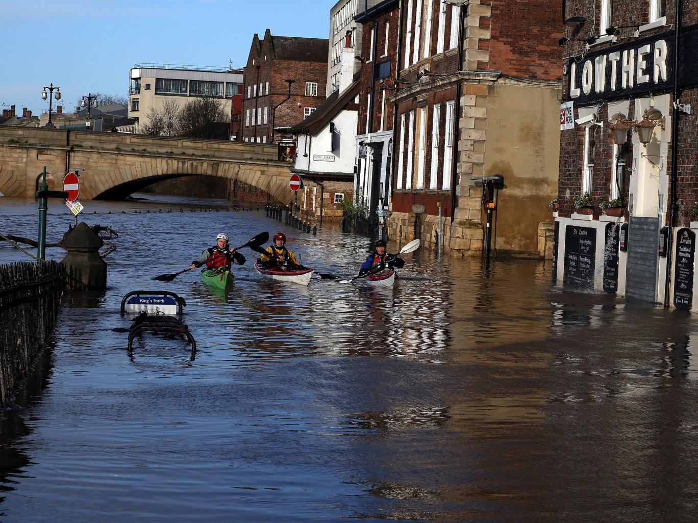 Canoeists check out buildings in flooded York