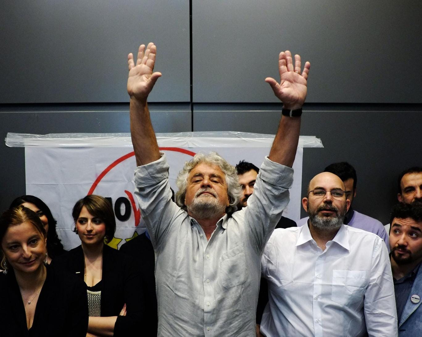 Five-Star Movement leader Beppe Grillo gestures during a news conference in Rome, 2013