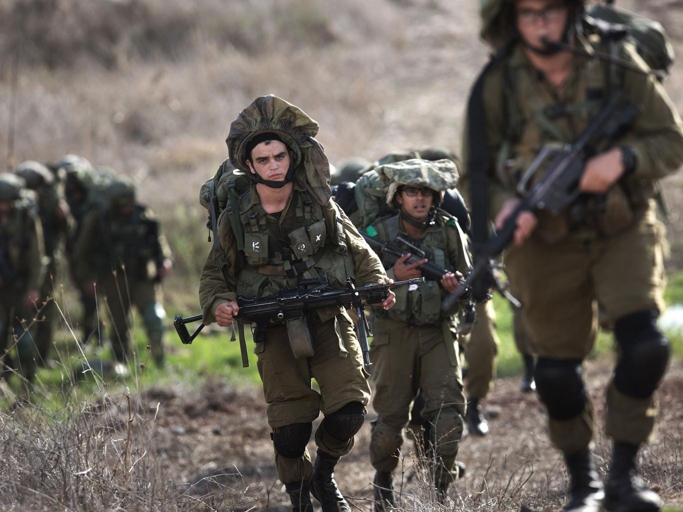 Israeli soldiers perform exercises in the Golan Heights. Stray rockets have occasionally – and apparently accidentally – struck across the border since the Syrian war began