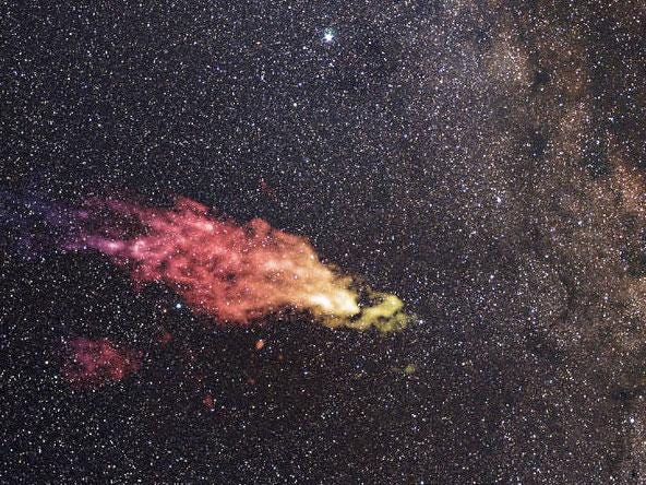 A composite image shows the Smith Cloud on the edges of the galaxy