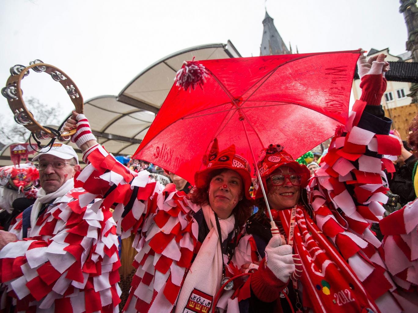 People wearing costumes celebrate carnival in Cologne, Germany. The carnival peak season has begun with increased security measures in place following a string of New Year's Eve attacks when scores of women reported to have been sexually harassed and robb