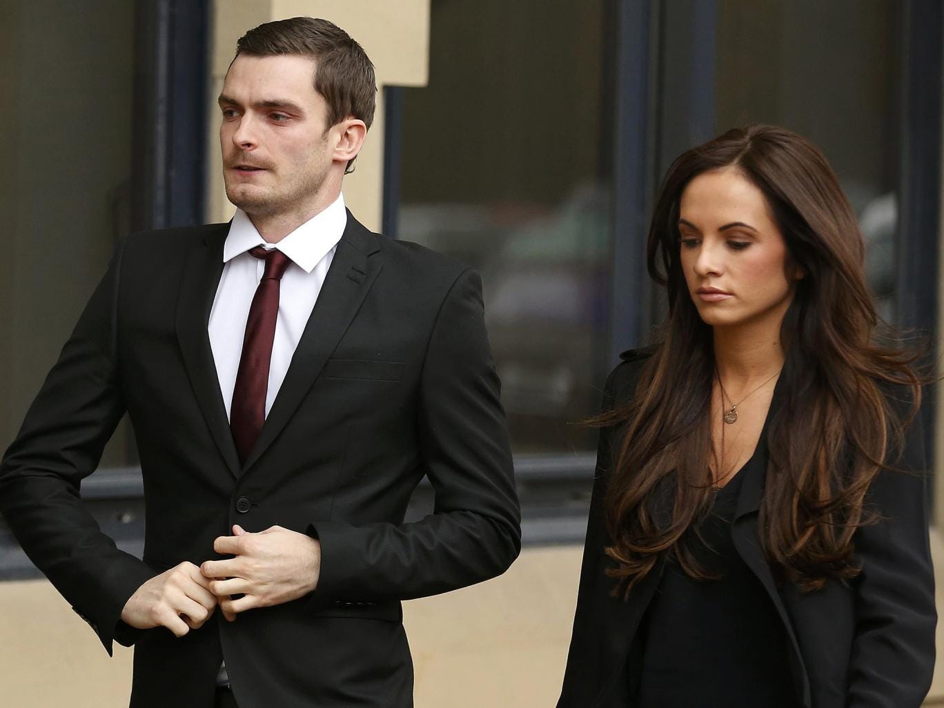 Former Sunderland soccer player Adam Johnson arrives with his girlfriend Stacey Flounders  at  Bradford Crown Court in Bradford,