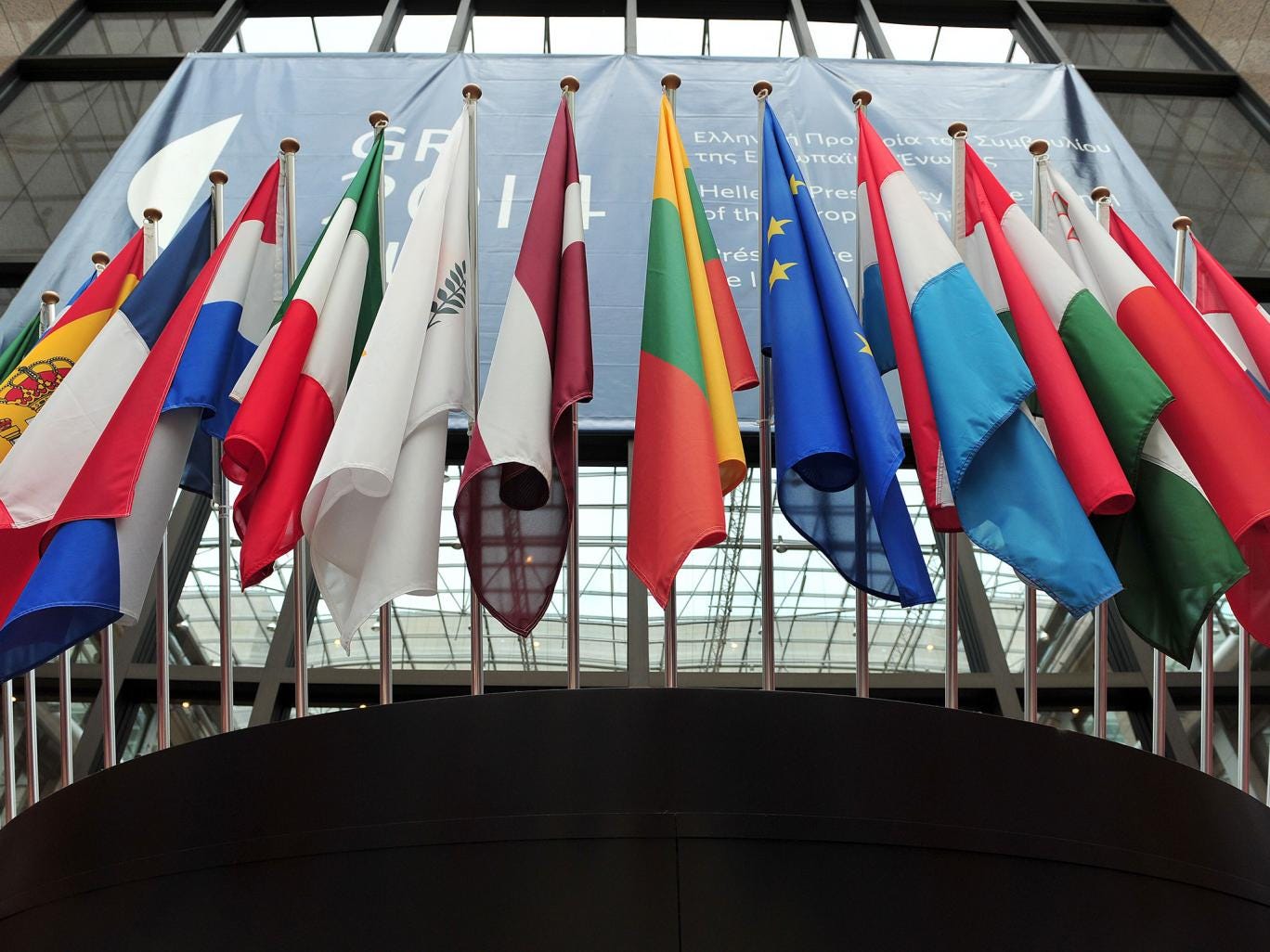 Flags of European countries above the entrance of the European Council 