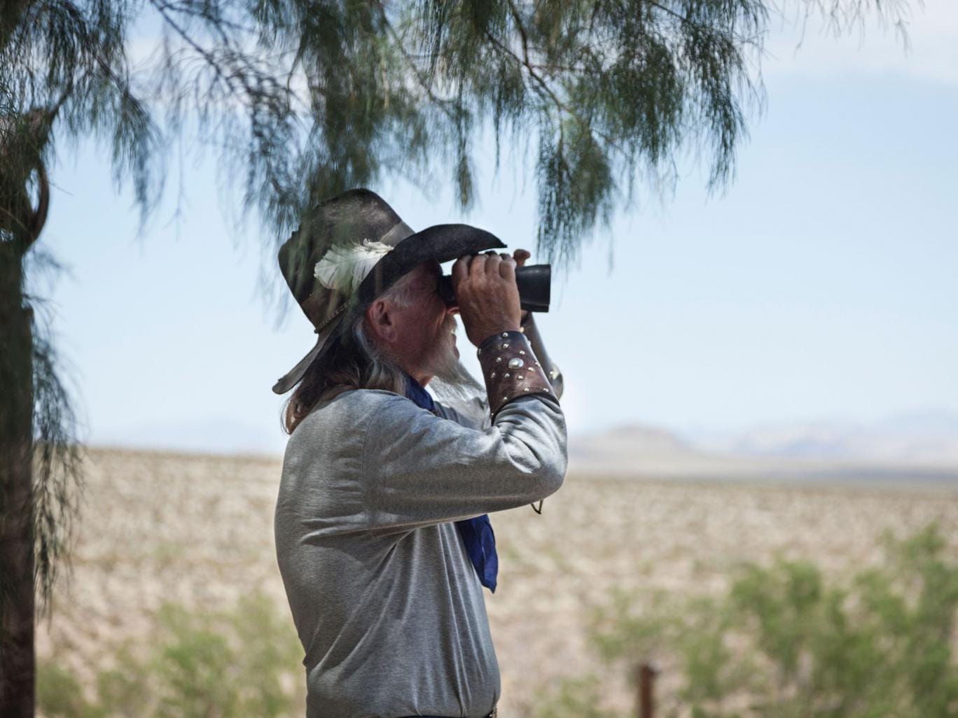 Billy Mitchell looks out over his land at Rattlesnake Ranch in California's Mojave desert