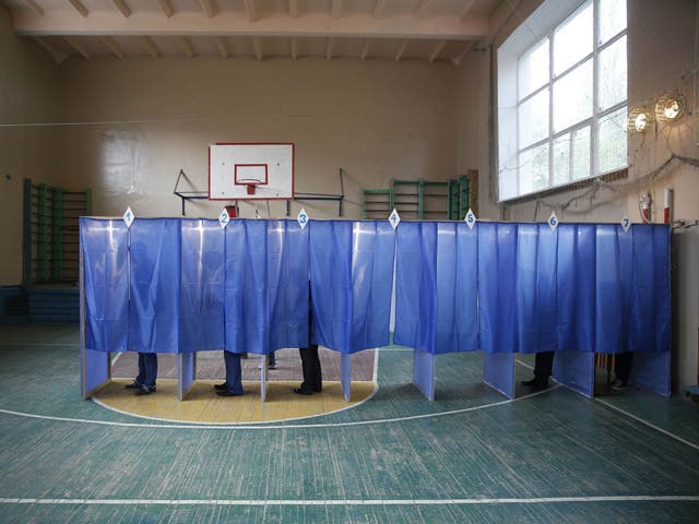 Voters visit a polling station to take part in the referendum on the status of Donetsk 