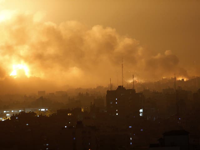 Smoke rises as flames spread across buildings after Israeli strikes in the Shijaiyah neighborhood in Gaza City 