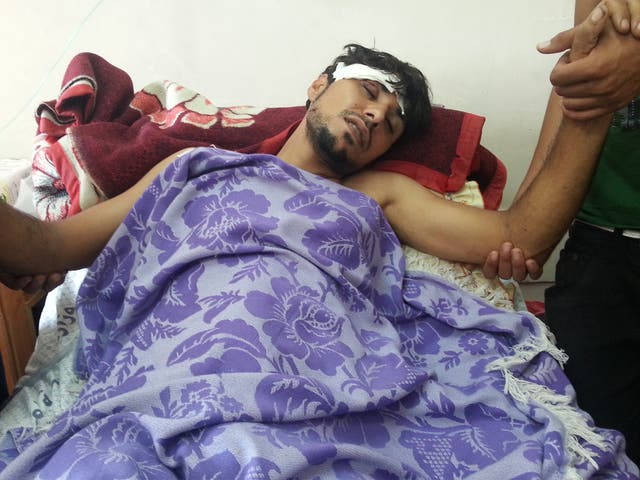An injured Palestinian at Al-Aqsa Hospital in Deir al-Balah