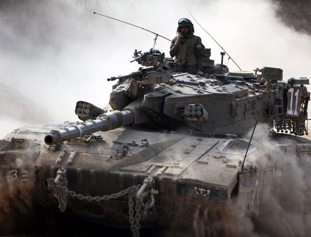 An Israeli army Merkava tank rolls along the border between Israel and the Hamas-controlled Gaza Strip. The UN Security Council joined US President Barack Obama in calling for an immediate ceasefire in Gaza, after Israel and Hamas ignored calls for a truce despite mounting civilian casualties