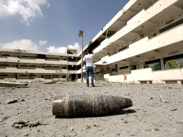 A shell lies on the ground at the heavily damaged Sobhi Abu Karsh school in Gaza City