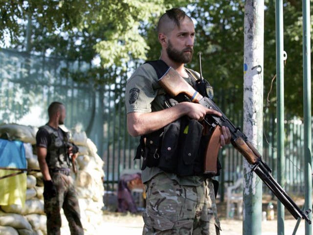 Ukrainian soldiers from the 'Azov' battalion guard their base in Mariupol, Donetsk 