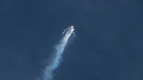 The Virgin Galactic SpaceShipTwo rocket explodes in the air during a test flight
