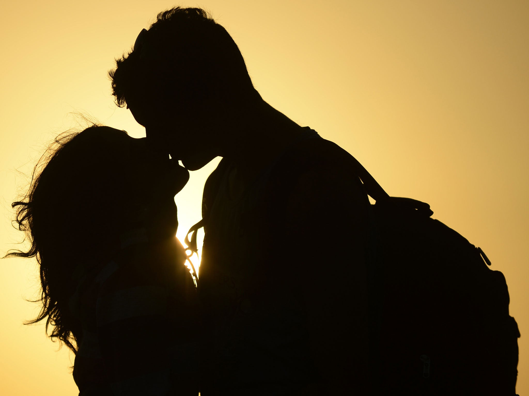 Black couple kissing photo