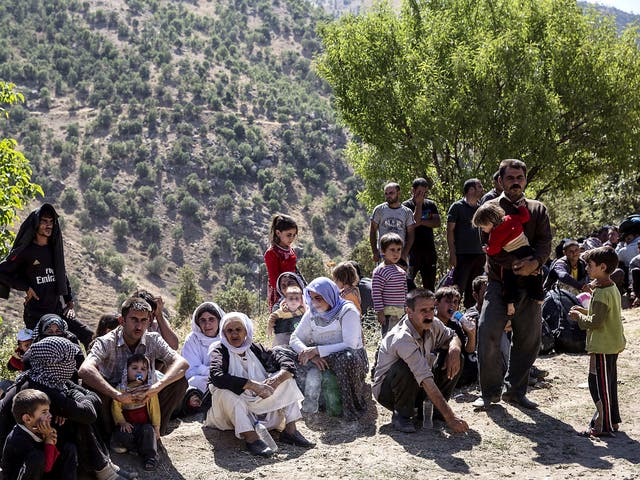 Isis conquered the Kurdish towns of Sinjar and Zumar in August 2014, forcing thousands of civilians to flee their homes. Pictured are a group of Yazidi Kurds who have fled             