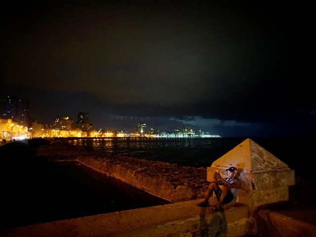 An internet hotspot at the sea front at the Malecon in Havana