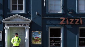 A police officer stands guard outside a branch of the Italian chain restaurant Zizzi where the pair dined at before falling ill. It was boarded off whilst investigators worked on the building and later found traces of the chemical weapon within it.