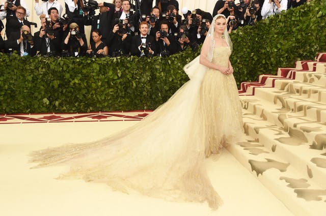 Kate Bosworth wears an ethereal Oscar de la Renta gown topped with a mantilla veil
