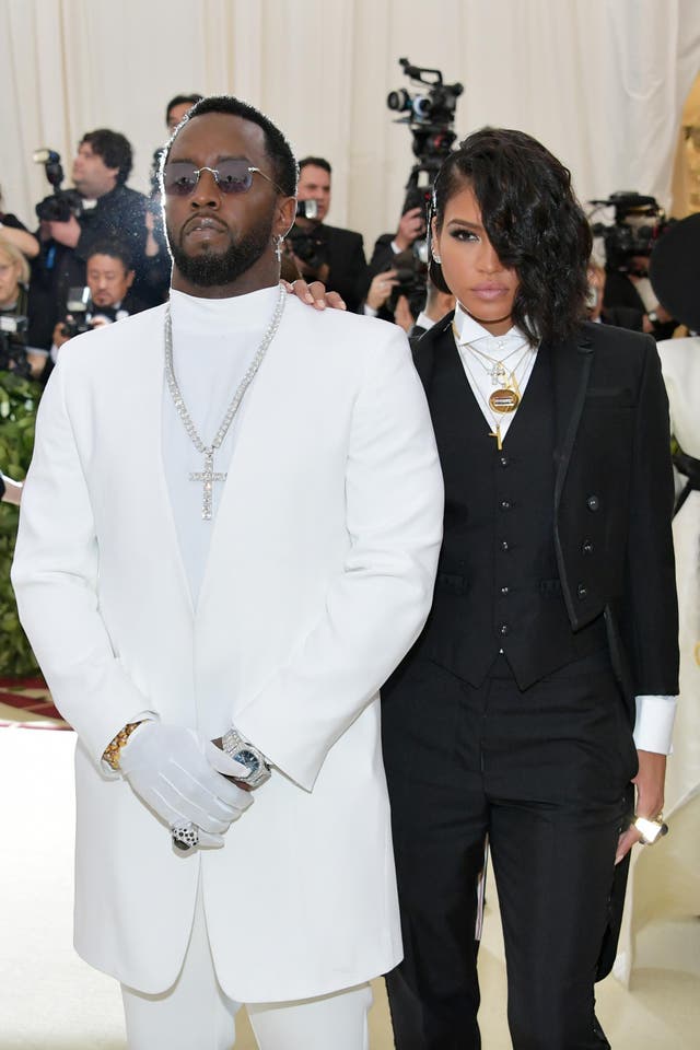 Sean 'Diddy' Combs wears a Musika Frere suit while Cassie opted for Thom Browne with Chopard earrings