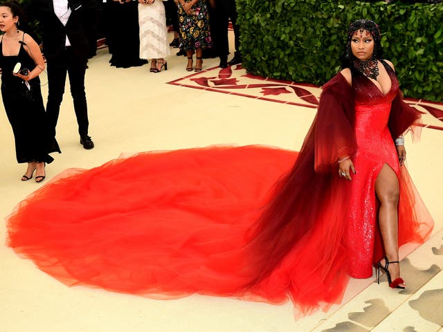 Nicki Minaj wears a red Oscar de la Renta gown and bejeweled headpiece