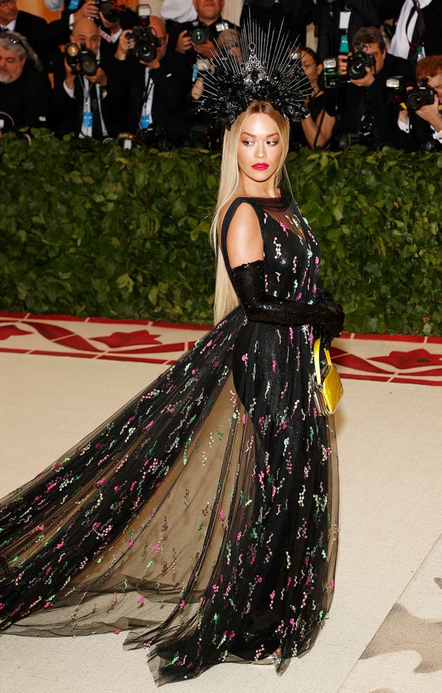 Rita Ora wears an all-black embellished ensemble by Prada 