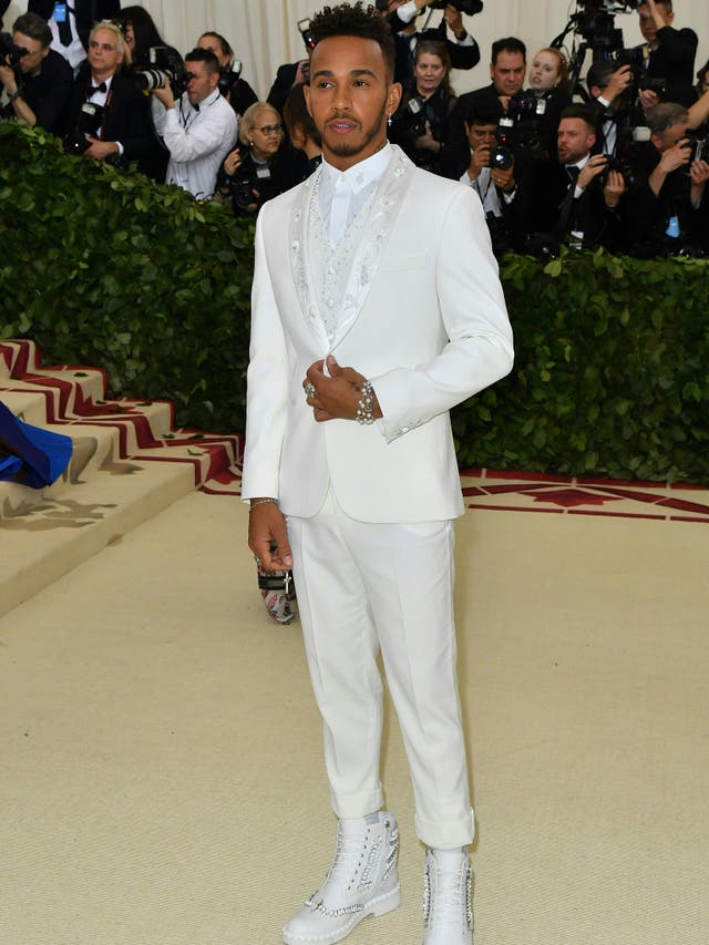 Lewis Hamilton wears an all-white ensemble designed by Tommy Hilfiger