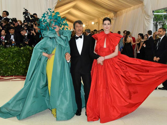 Frances McDormand wearing a Versace gown and Philip Treacy headpiece, Pierpaolo Piccioli, and Anne Hathaway sporting a Valentino Couture red ballgown