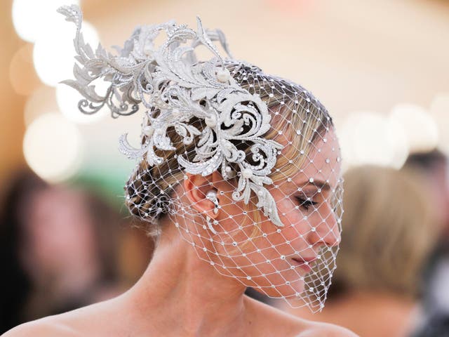 Diane Kruger accessorised her Prabal Gurung gown with a custom Philip Treacy head piece