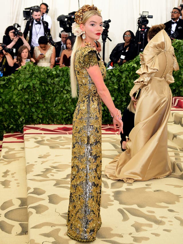 Anya Taylor-Joy wears a gold tapestry Dolce & Gabbana dress