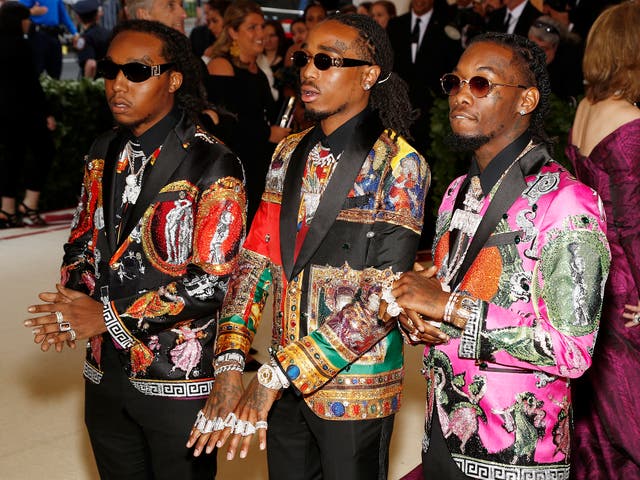 Atlanta-based trio, Migos, wear sequinned Versace suits