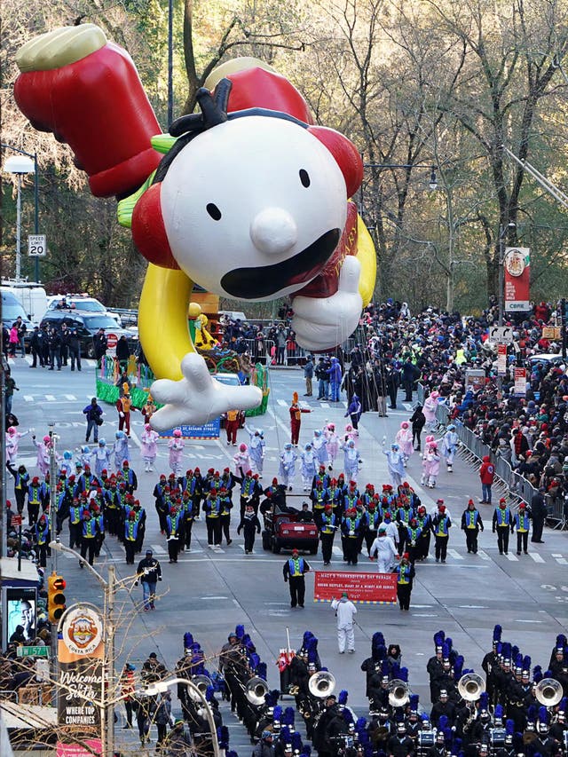 A balloon flies in the parade
