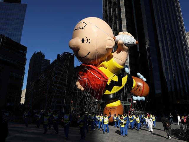 The Charlie Brown balloon flies in the parade