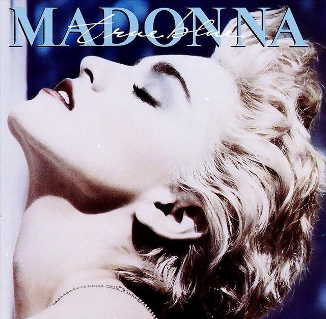 This shot was taken by celebrated photographer Herb Ritts, who later teamed up with Madonna for the “Like a Prayer” and “You Can Dance” covers. It is one of her most recognisable images, inspired in part by Andy Warhol’s pop art and also by the iconography of Madonna’s idol Marilyn Monroe. Ici, she invites fans to make the immediate connection between pop art and commercial value, making her the first to exploit the late Eighties concept of pop artist as brand.
