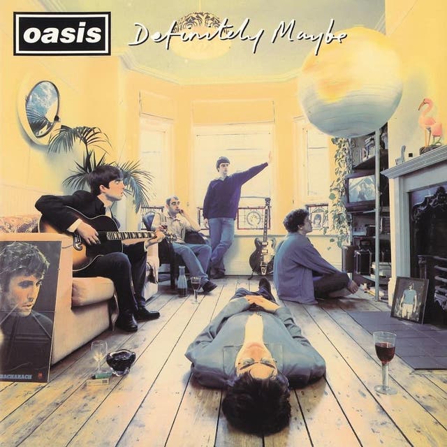 Photographer Michael Spencer Jones had a task on his hands organising Oasis for what is indisputably their best album cover. It was different to what the band originally envisioned – Noel Gallagher had spotted a photo of the Beatles sat round a coffee in Japan, so thought Oasis could be photographed at the dining table of guitarist Bonehead’s house in Manchester. Jones didn’t see this working, so spread the members around Bonehead’s living room instead, and asked them to bring objects that were personal to them for decoration. Noel liked Jones’s idea of hanging an inflatable globe (brought by one of the roadies) from the ceiling. 「ええ, global dominance," 彼は言った. Soon after the album’s release, that’s exactly what happened.