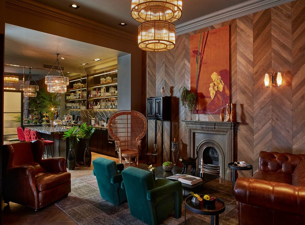 Relax with a drink in the opulent lounge area at Hotel Collect