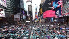 Each year, hundreds of people take part in a yoga class in Times Square to celebrate the summer solstice