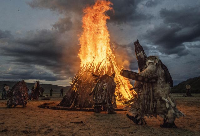 Mongolian Shamans participate in a fire ritual to mark the summer solstice