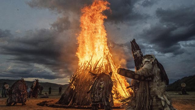 Mongolian Shamans participate in a fire ritual to mark the summer solstice